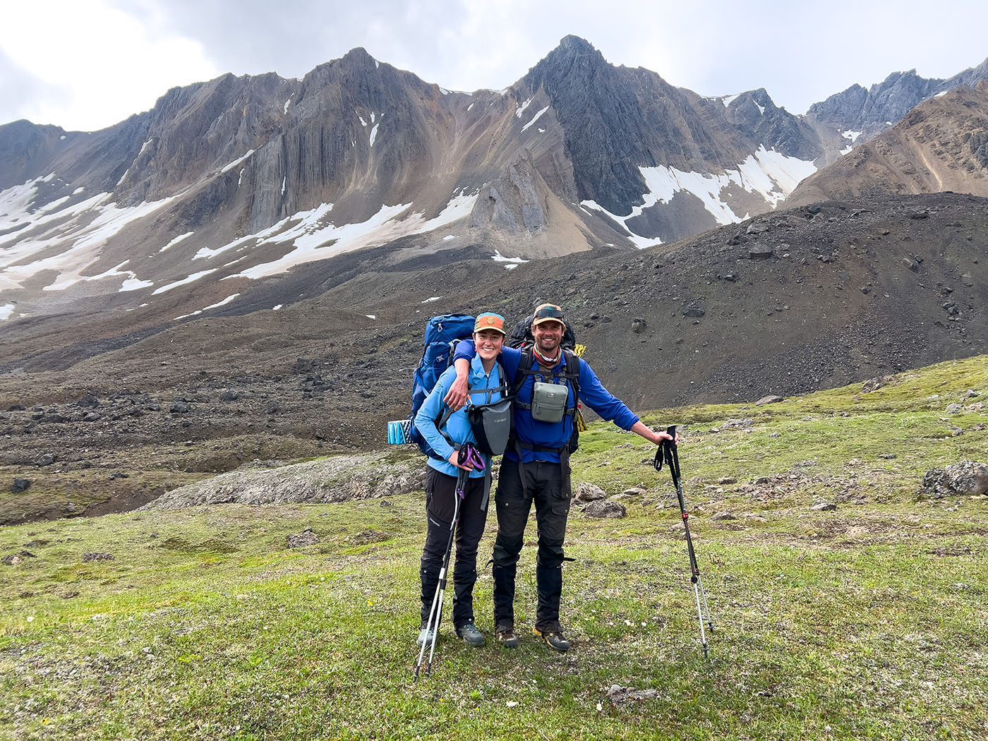 backpackers in front of the mountains