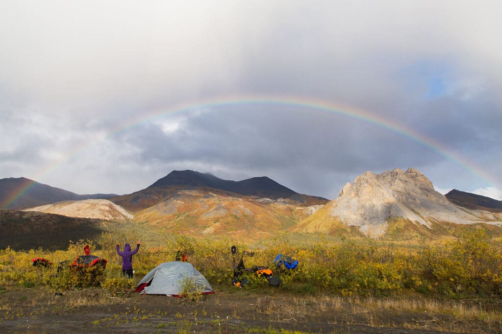rainbow over a campsite