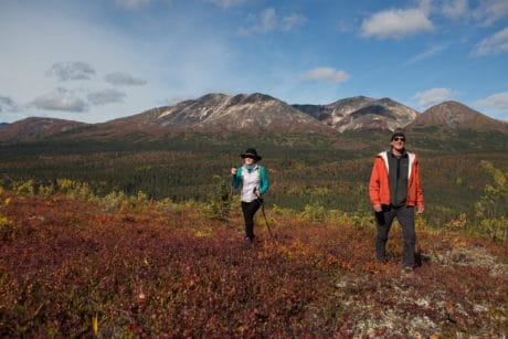 Hikers take in the view during the autumn season.