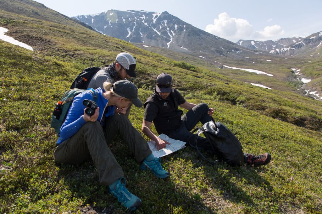 Looking at a map with their guide.